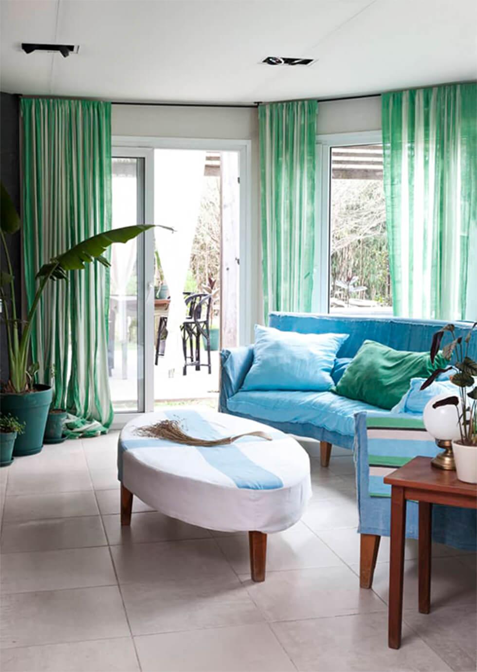 Refreshing south-facing living room with mint curtains