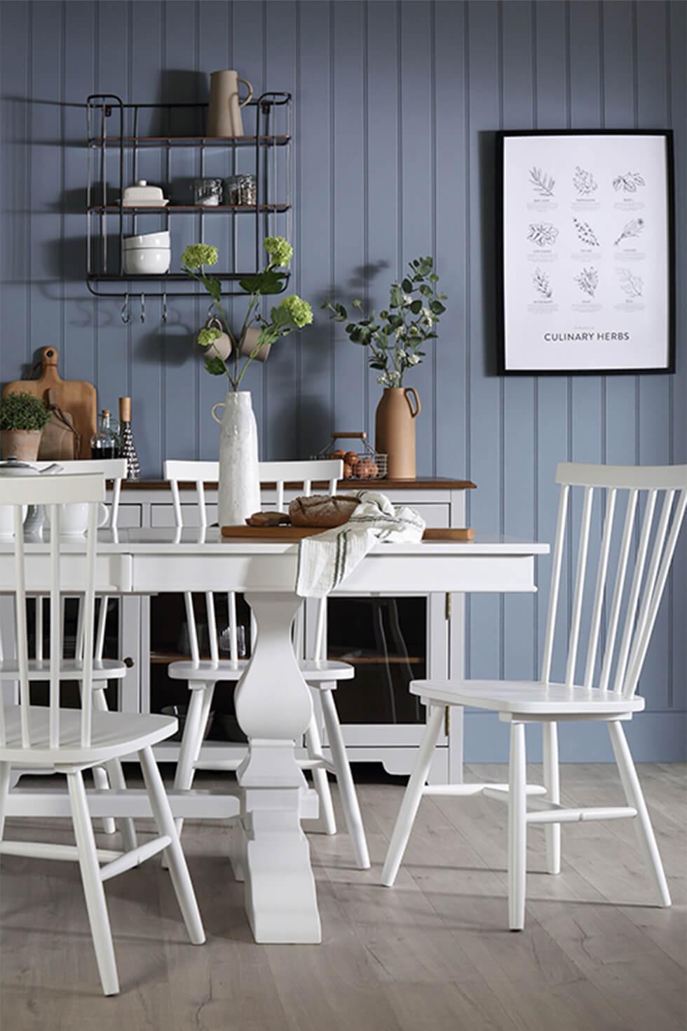 Blue dining room with white dining set