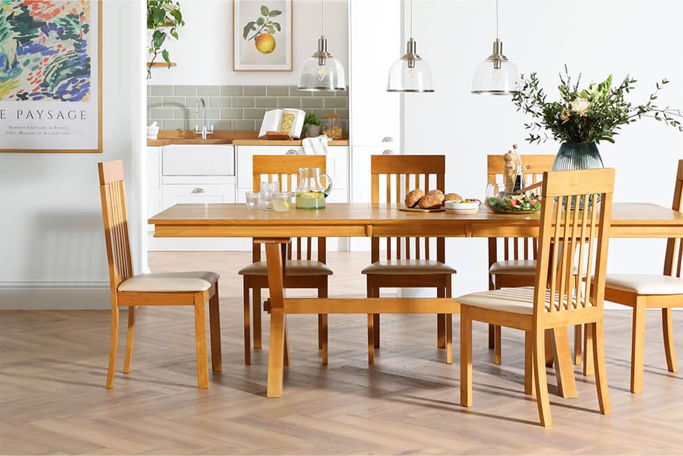 Oak dining set in an airy white dining room