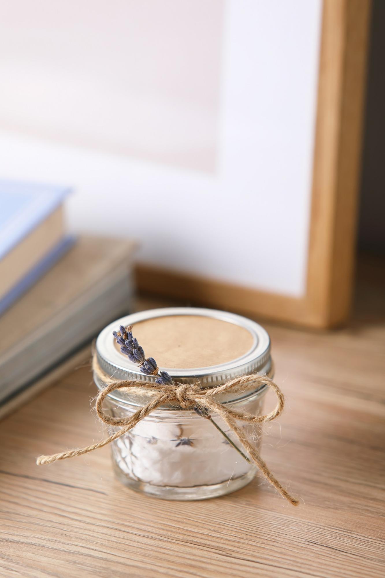 DIY natural air freshener in a mason jar tied with a sprig of lavender