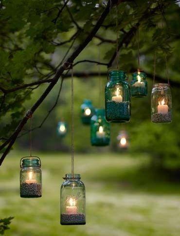 Candles in jars strung up with string