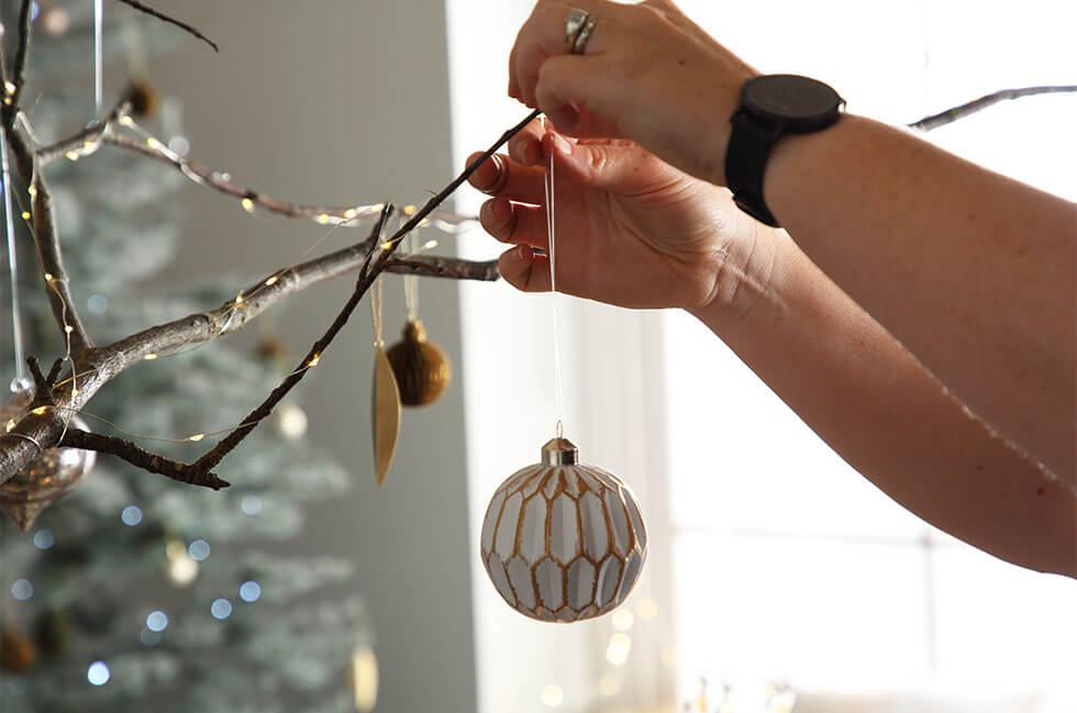 Decorating with Christmas baubles.