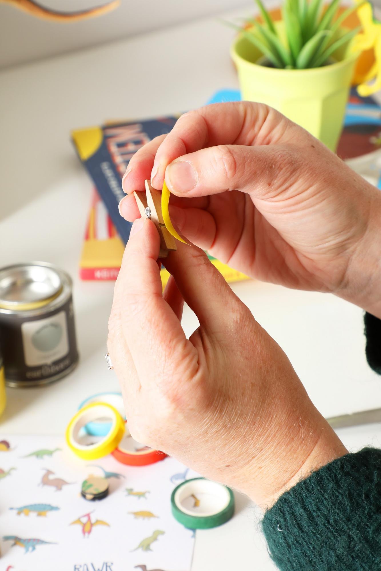 Covering craft pegs with washi tape