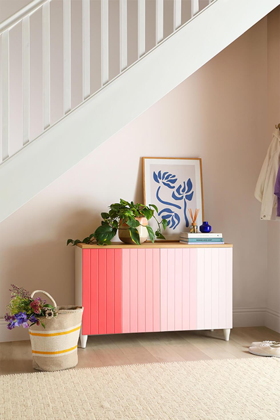 Completed pink diy ombre sideboard styled with plants and pantone ss21 colours