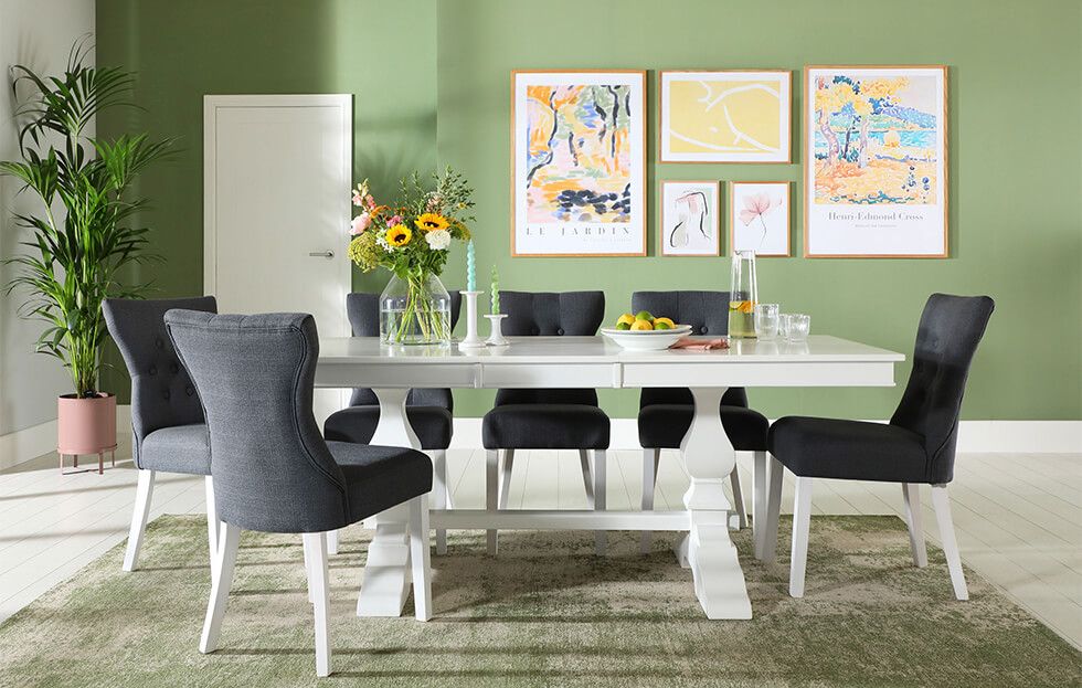 Spring dining room with green walls and white dining set