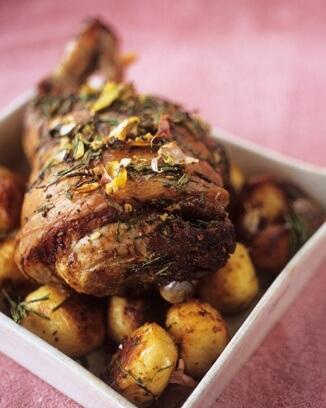 Roasted meat on bed of potatoes.