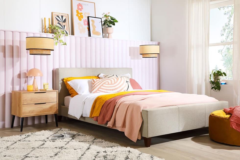 Bedroom with statement headboard, lamp and lacquer art