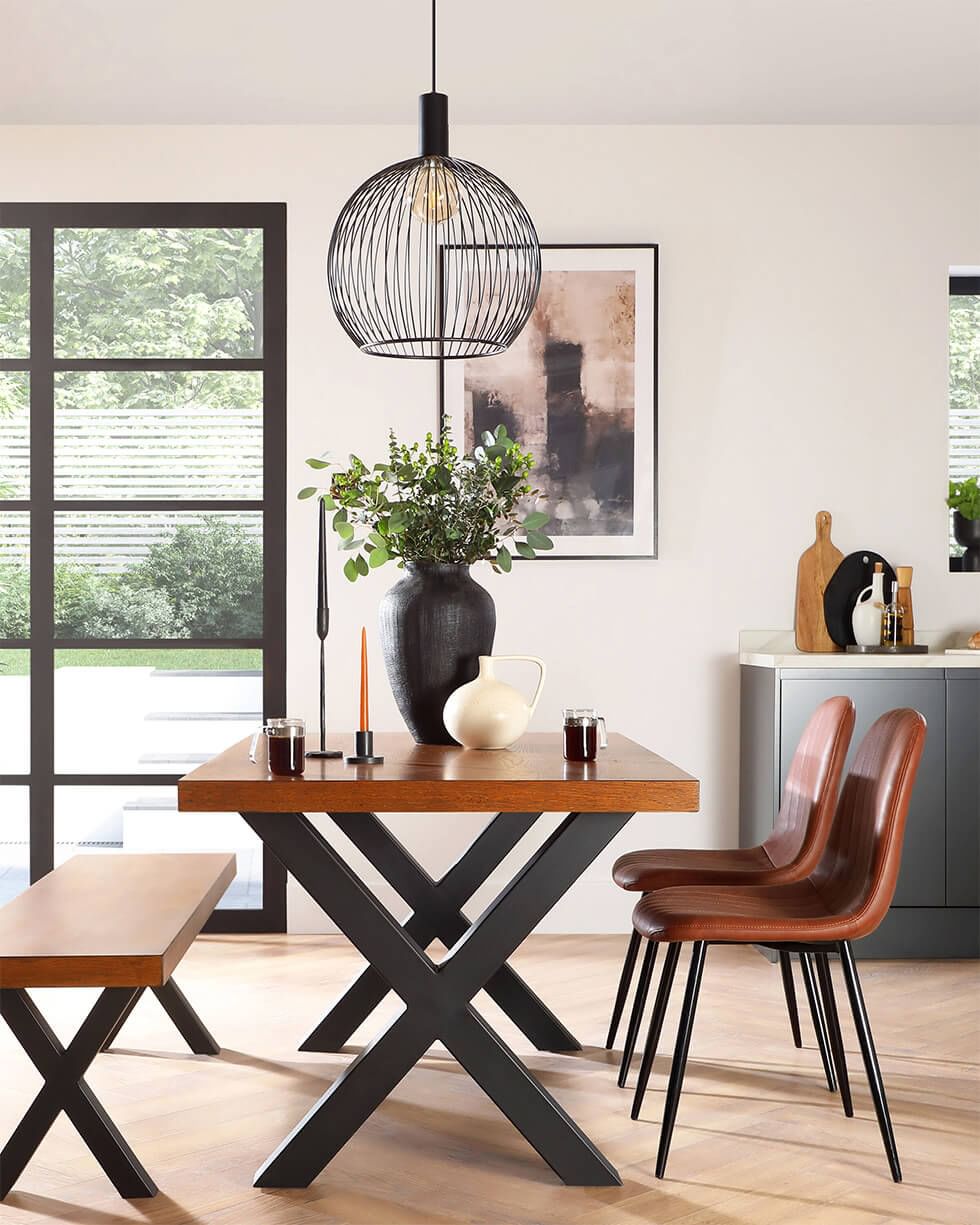 Black and oak dining set in a living room with large black window frames