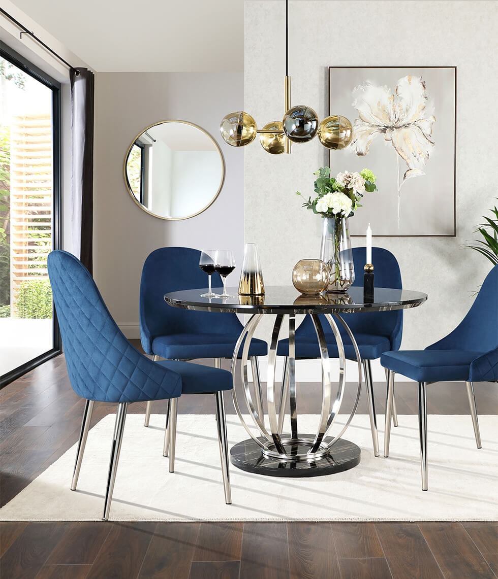 Feng shui dining room with a round table and blue dining chairs