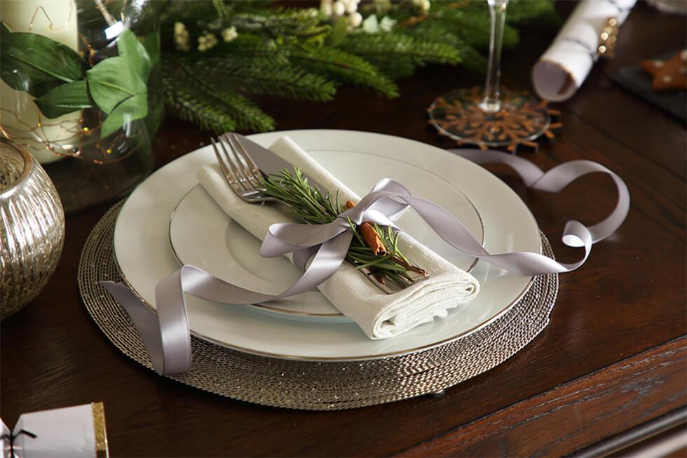 Close up of decor of christmas dinner table setting