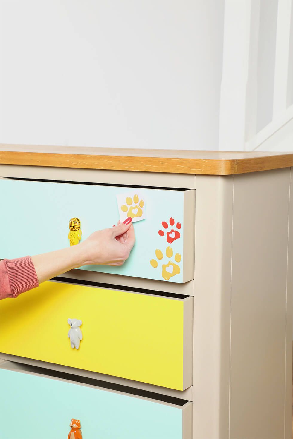 Attach decal stickers to the dresser