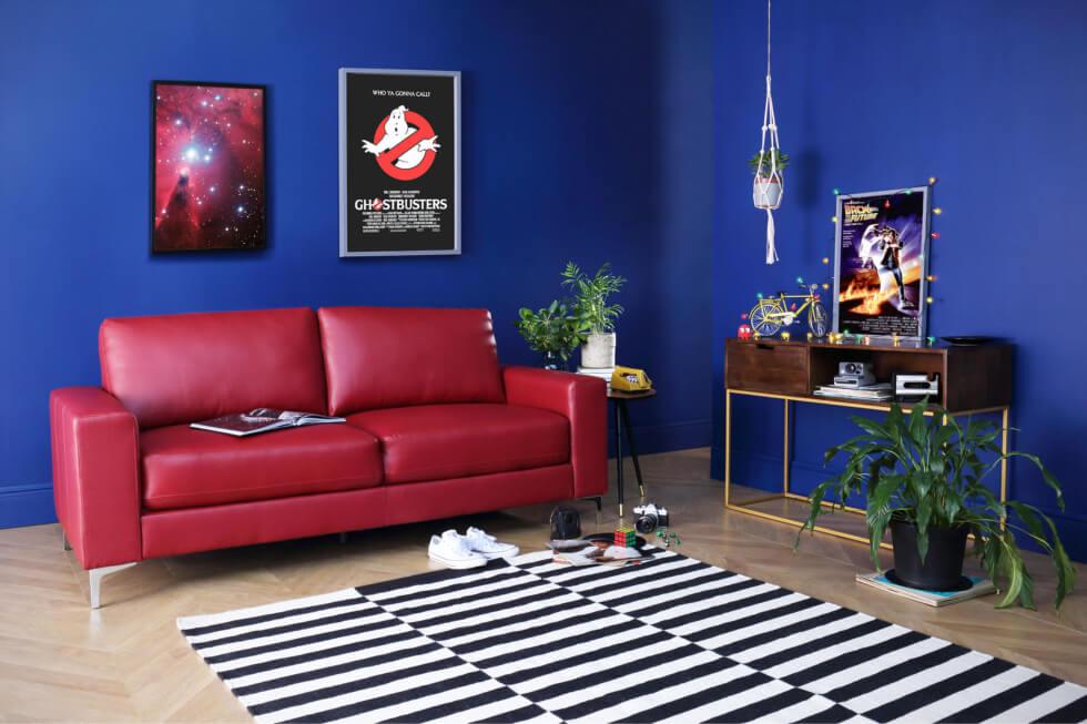 Stranger Things inspired living room with blue walls and red leather sofa