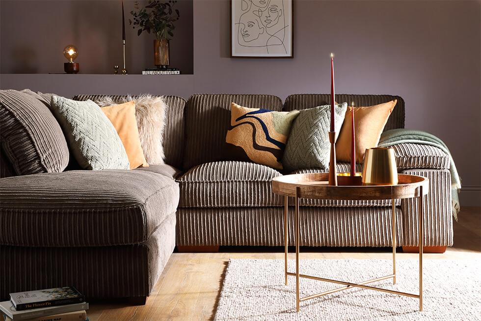 mink cord sofa in a cosy grey living room