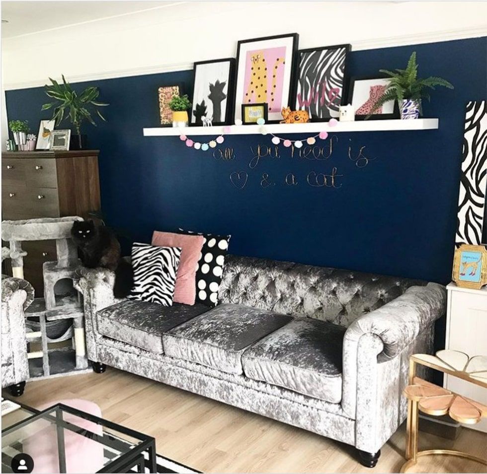 Distinctive grandmillennial living room with crushed velvet Chesterfield sofa