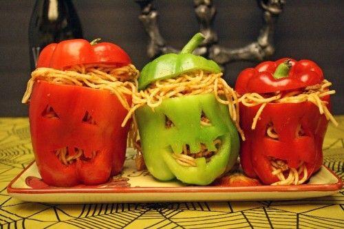 Spaghetti-stuffed bell-peppers with Halloween faces.