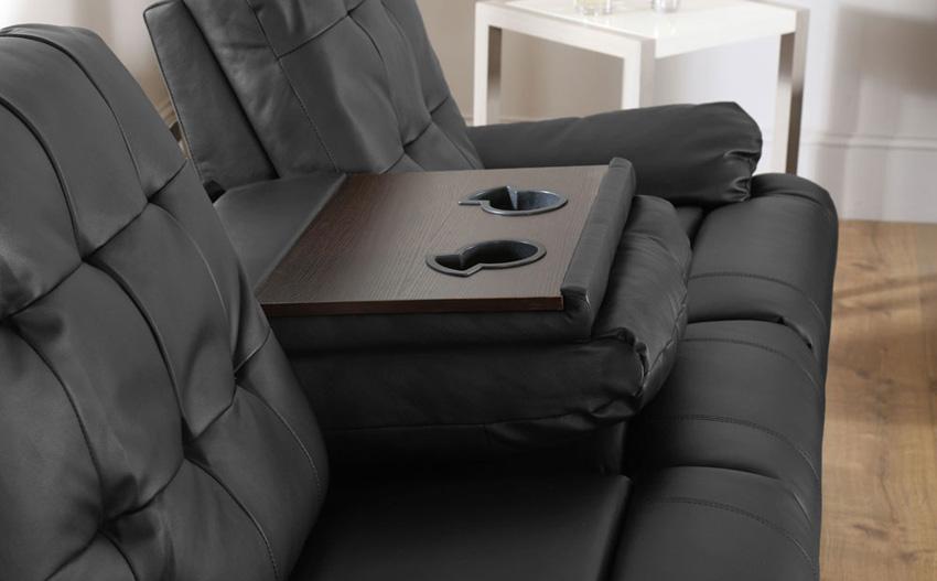 Drink holders on a black leather sofa