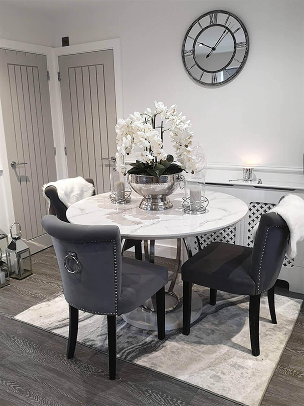 Dining room with a large faux orchid white centrepiece