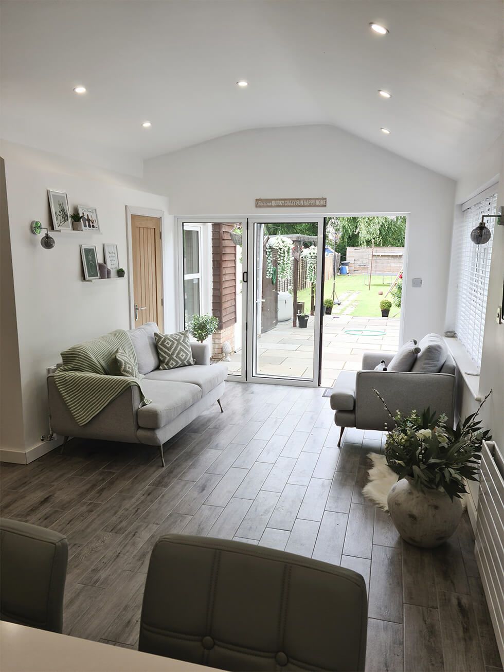 Cosy neutral living room which opens up into the patio