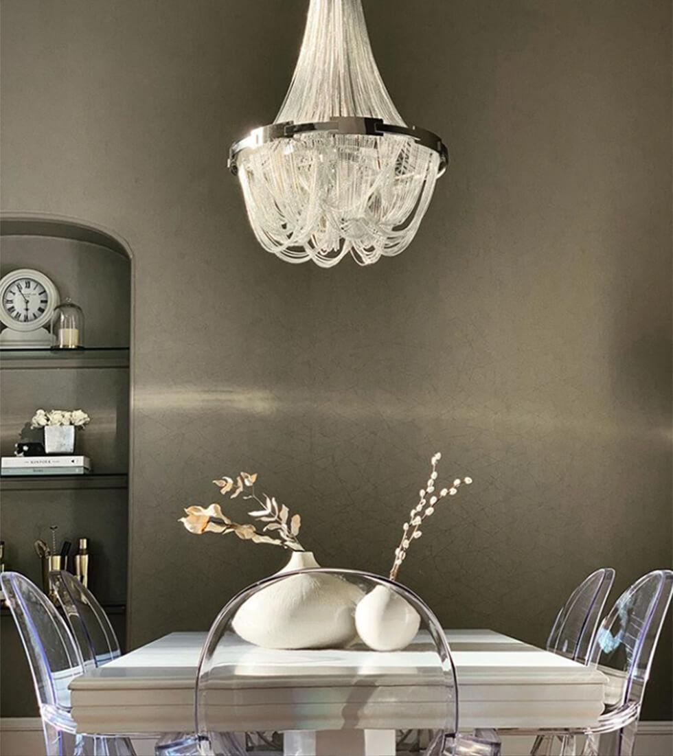 Neutral dining room with white dining table and Philippe Starck Ghost chair