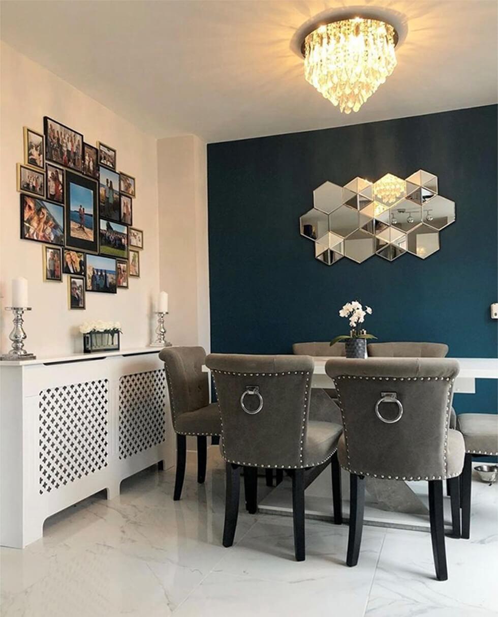 dining room with teal wall and grey dining chairs