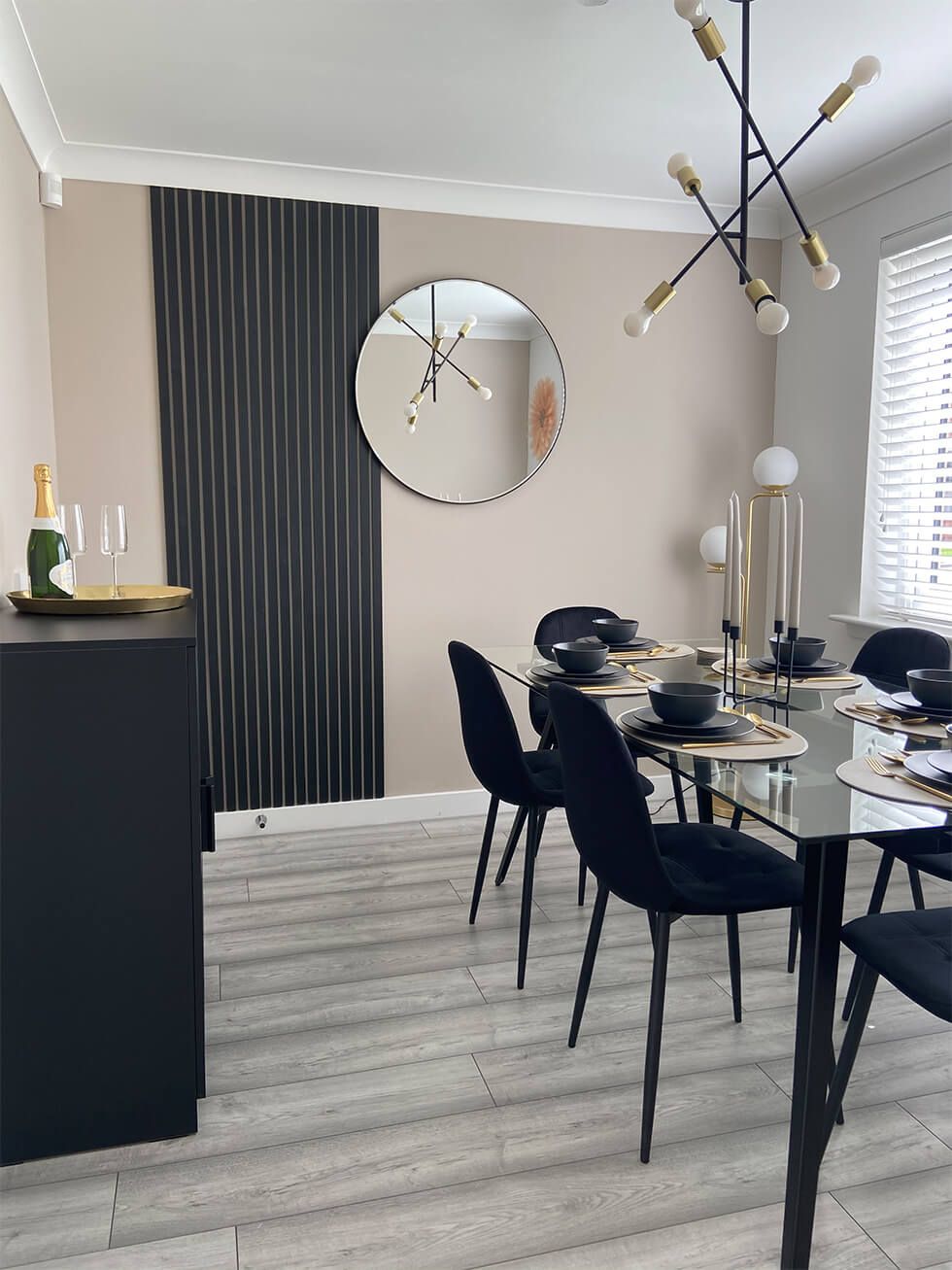 Contemporary dining room with black dining set and black accents