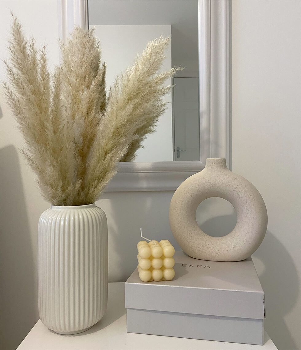 Curved vases and pampas grass