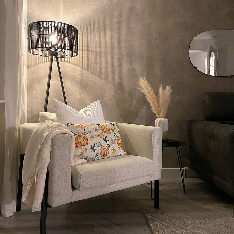 Black standing lamp with fabric armchair