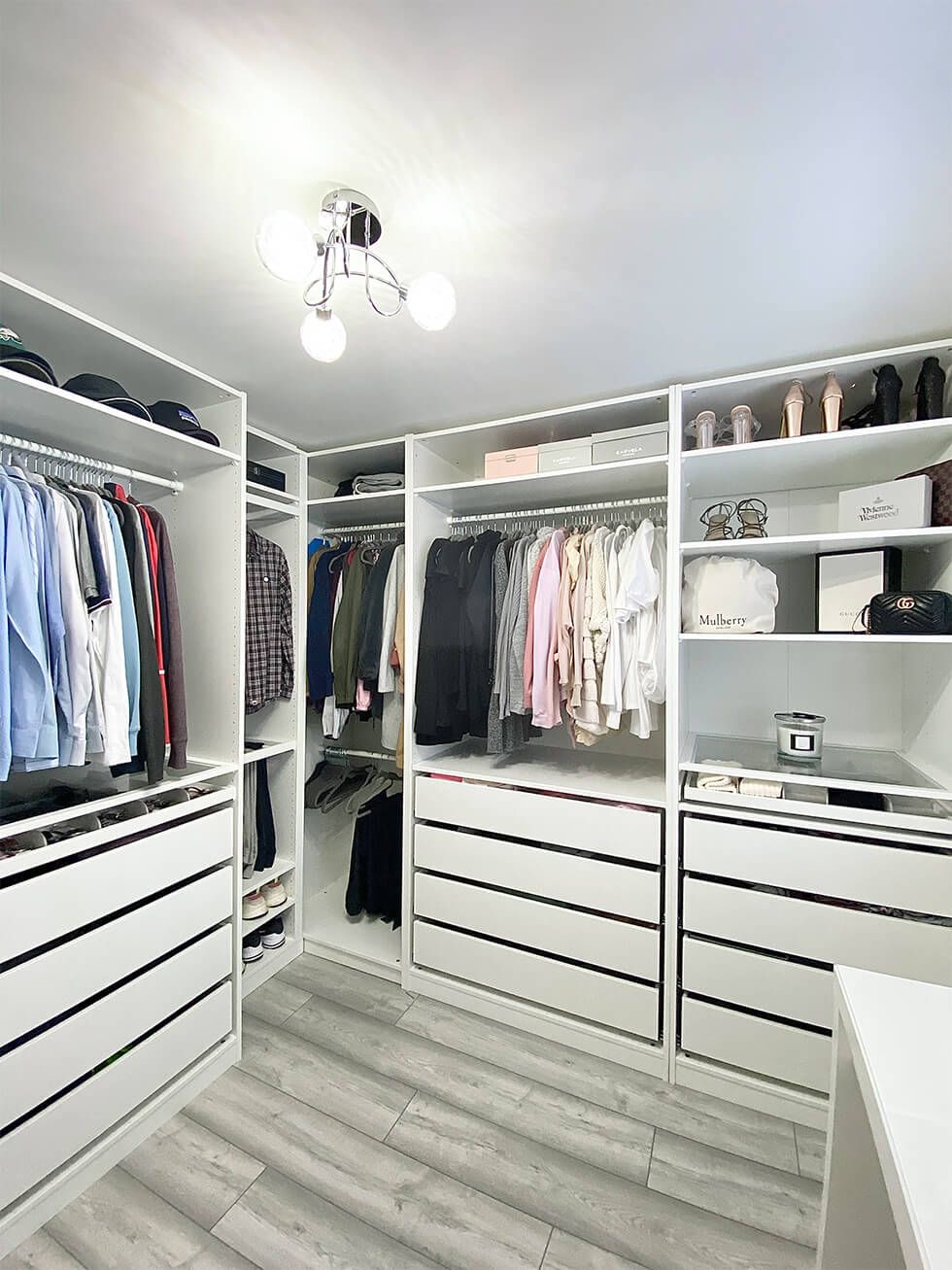 Organised dressing room with white built-in cupboards