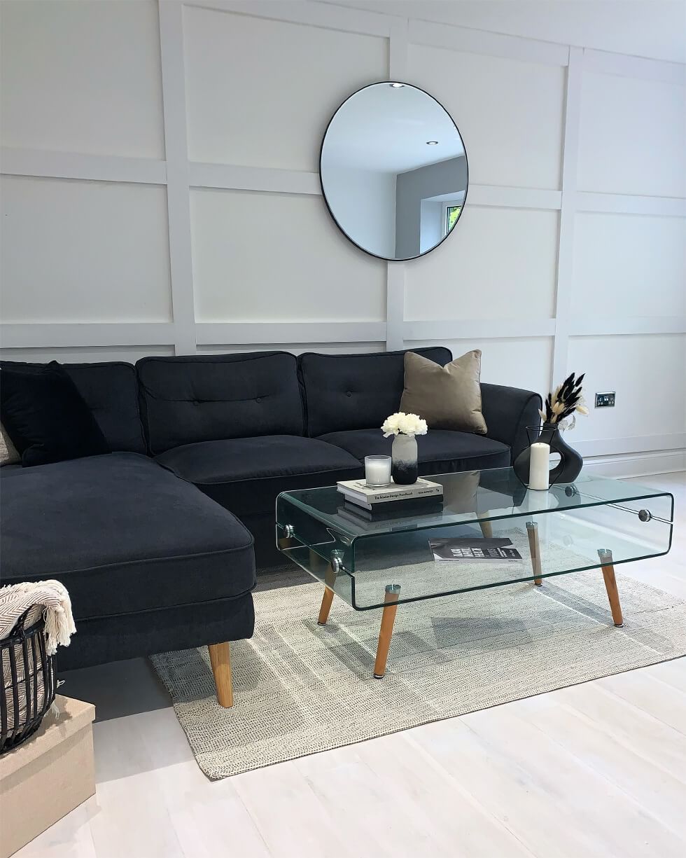 Grey corner sofa in living room with cosy wall panelling