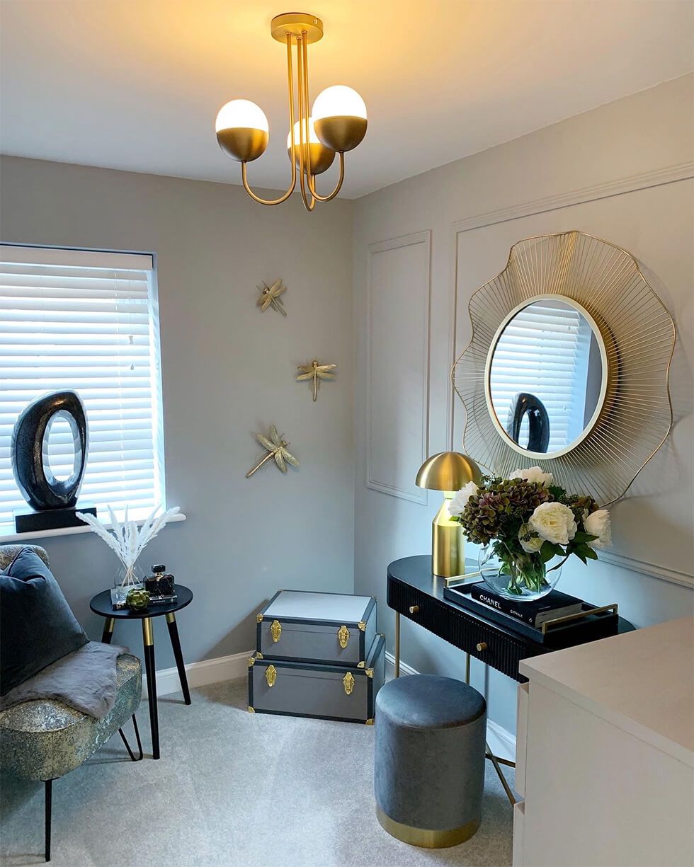 Art Deco-inspired dressing room with gold accents and geometric shapes