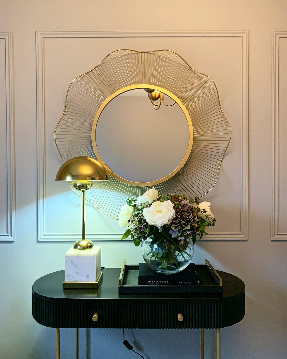 Classic wall panelling and a big mirror as the centrepiece of the room<