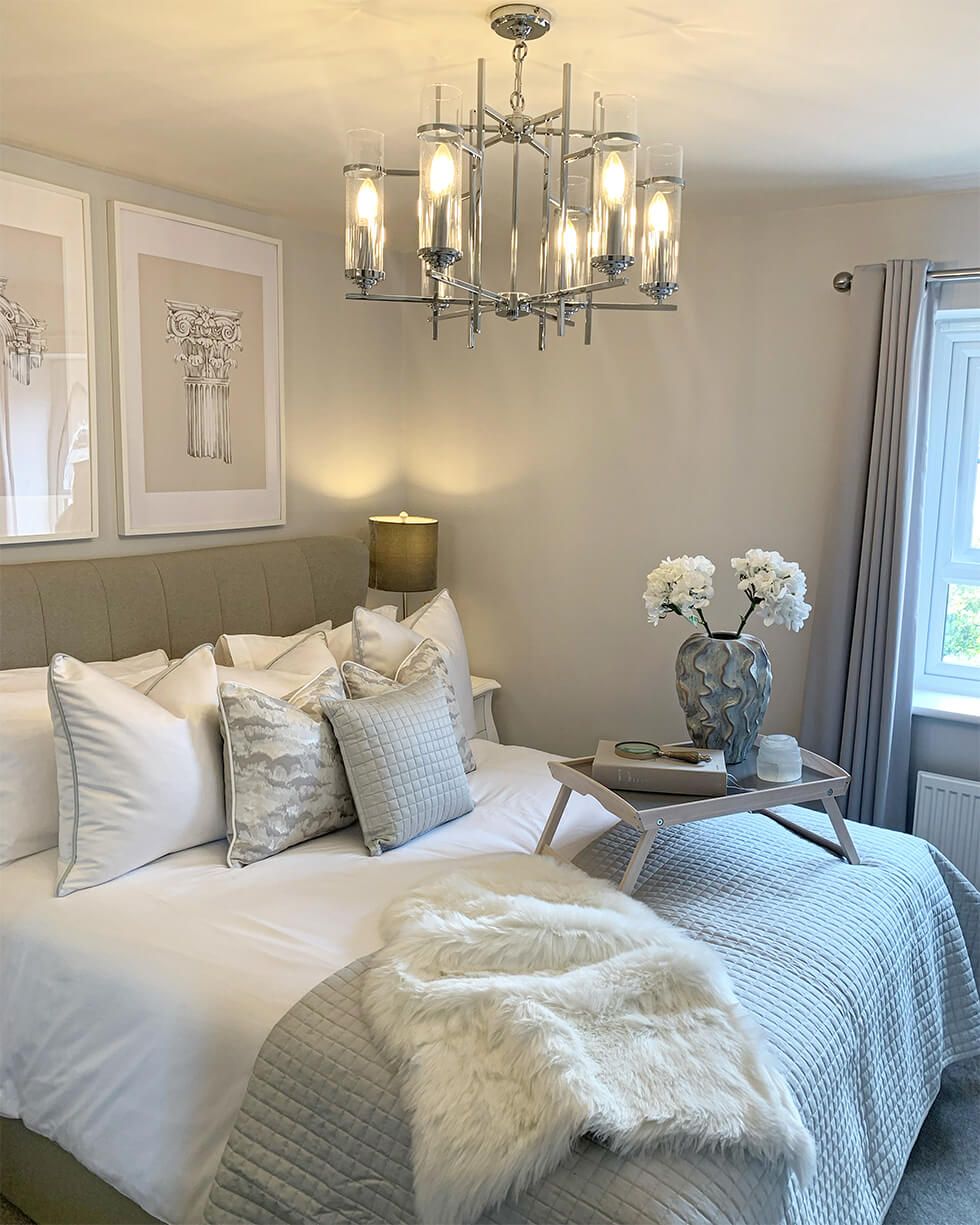 Sophisticated grey bedroom with statement lighting