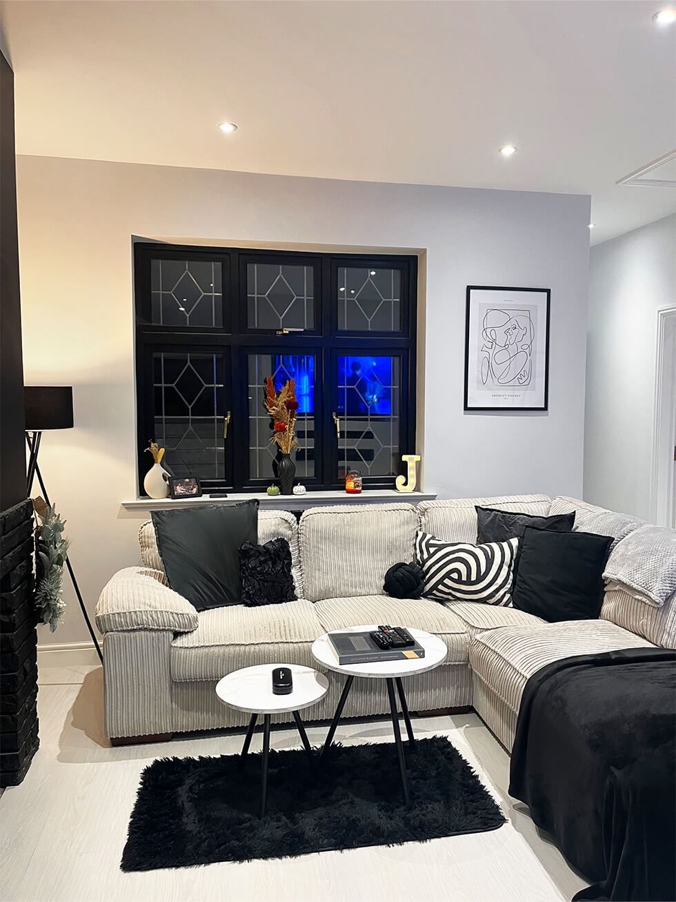 Cosy cord sofa in monochrome living room