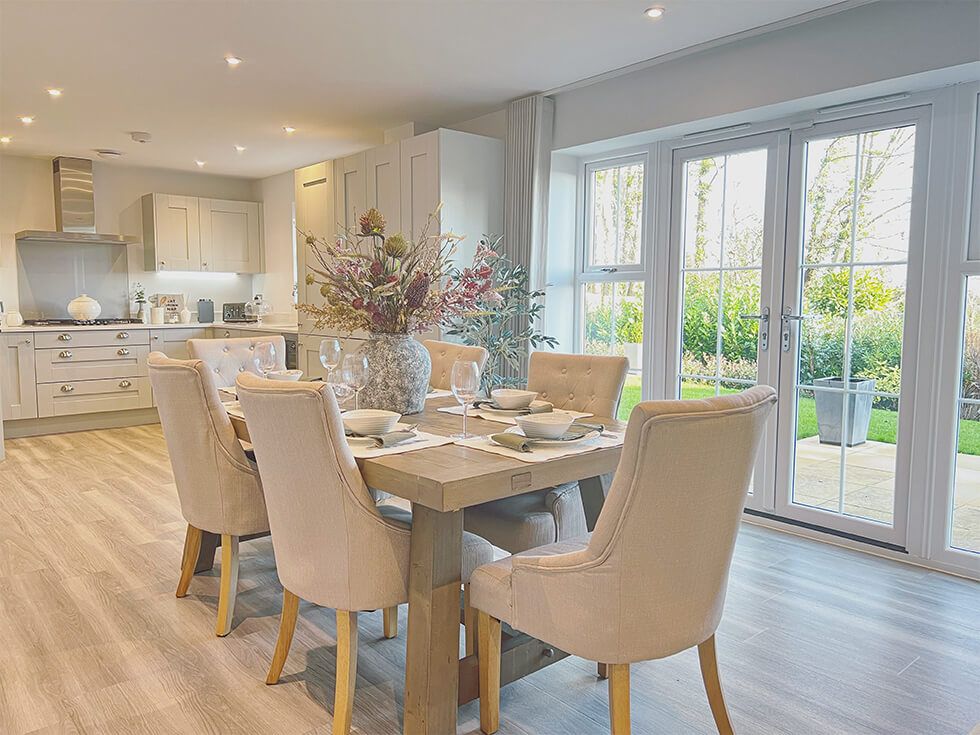 Stylish kitchen diner with Duke dining chairs and oak table