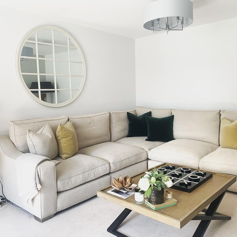Neutral living room with off-white L-shaped sofa