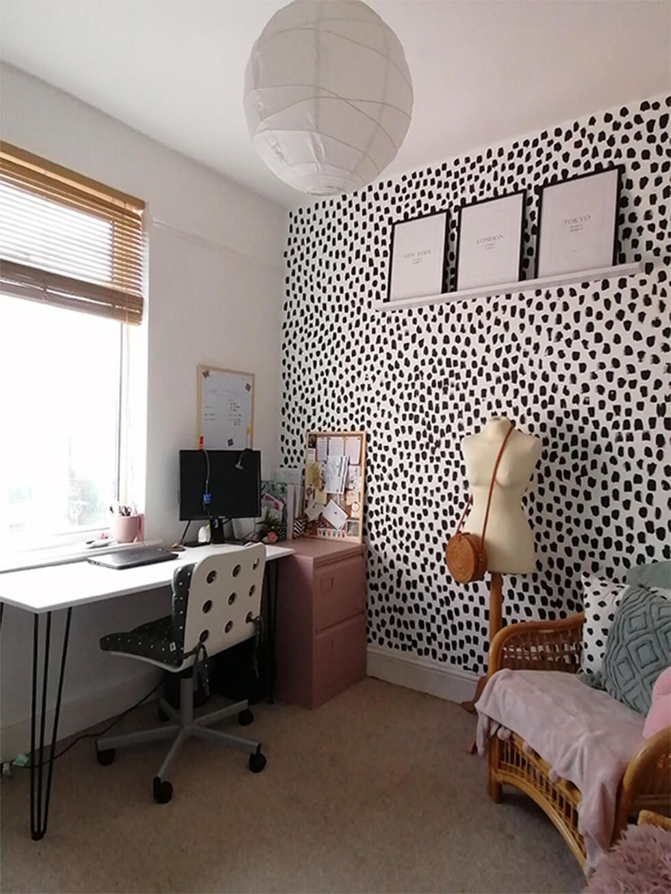 Home office with polka dot feature wall