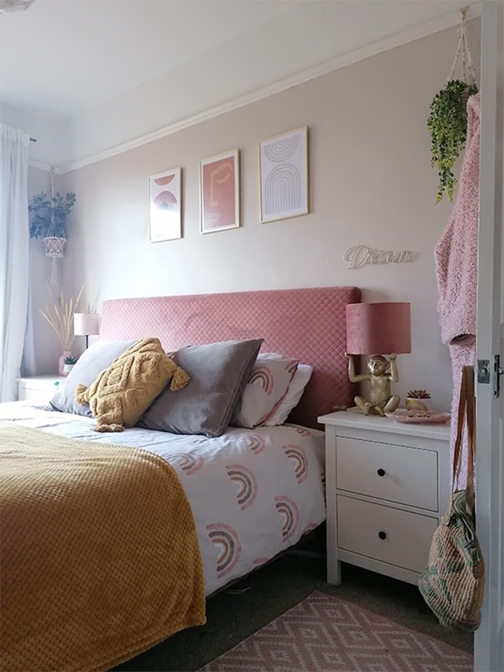 Bedroom with pink accents and hanging plants