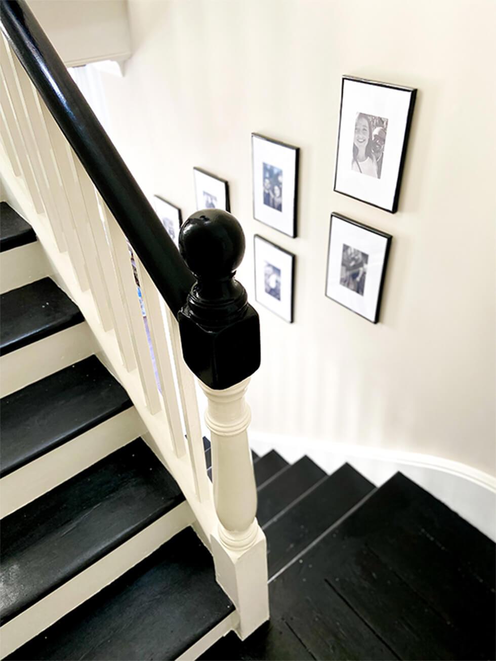 wooden staircase with gallery wall