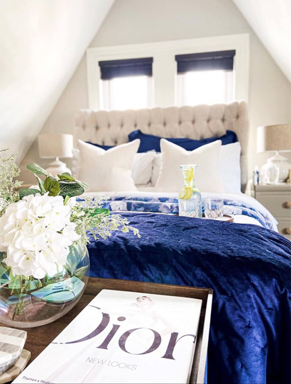 bedroom with farmhouse decor and blue bedding