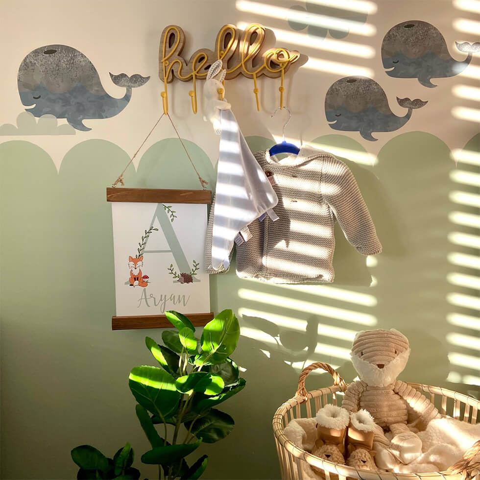 A nursery with a cute animal mural