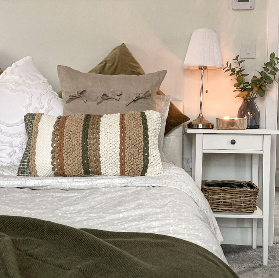 Textured pillows in a modern country bedroom