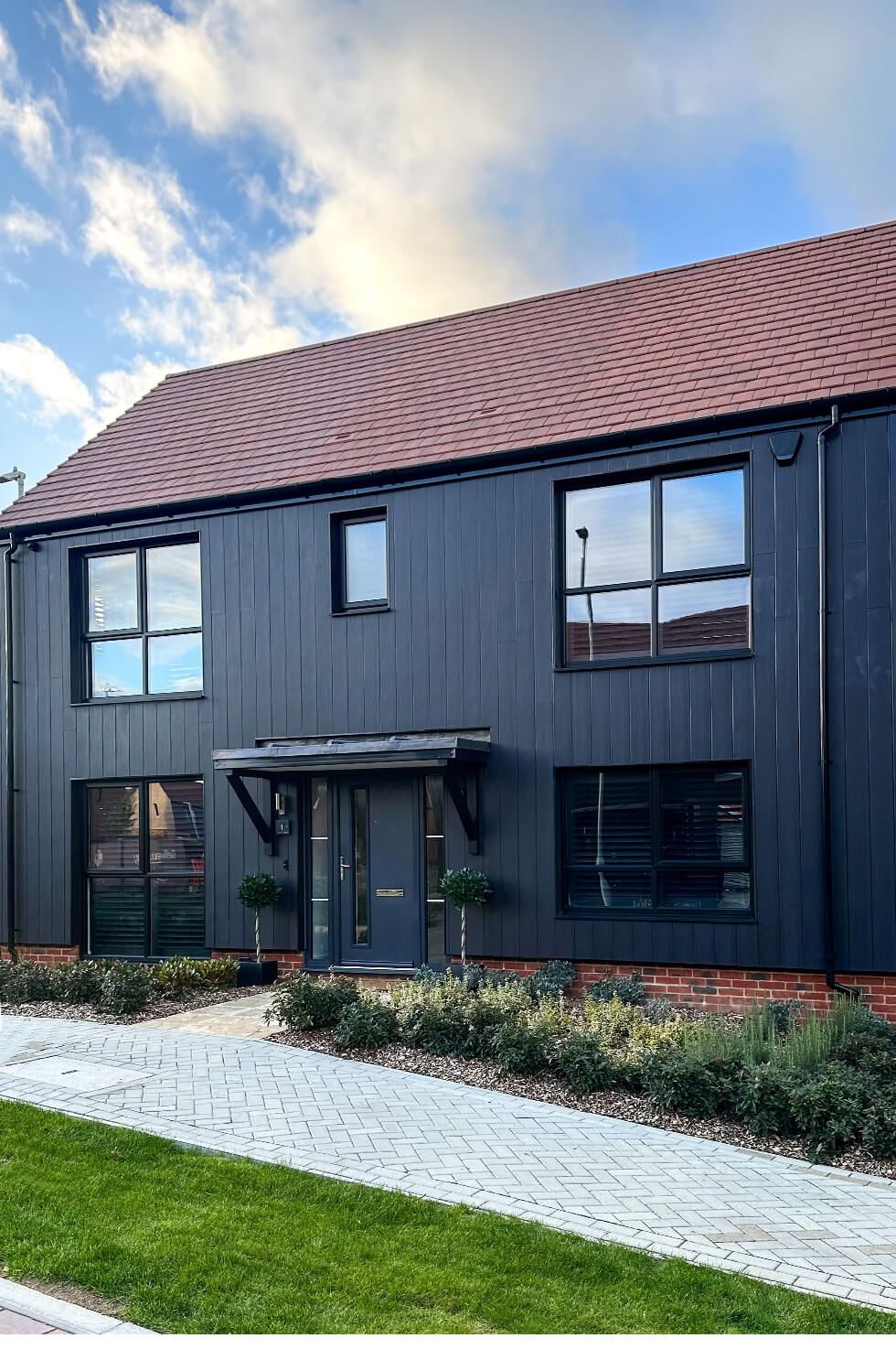 Home exterior with black cladding