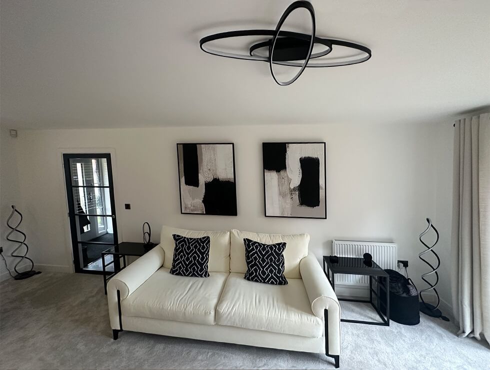 White living room with chic black accents