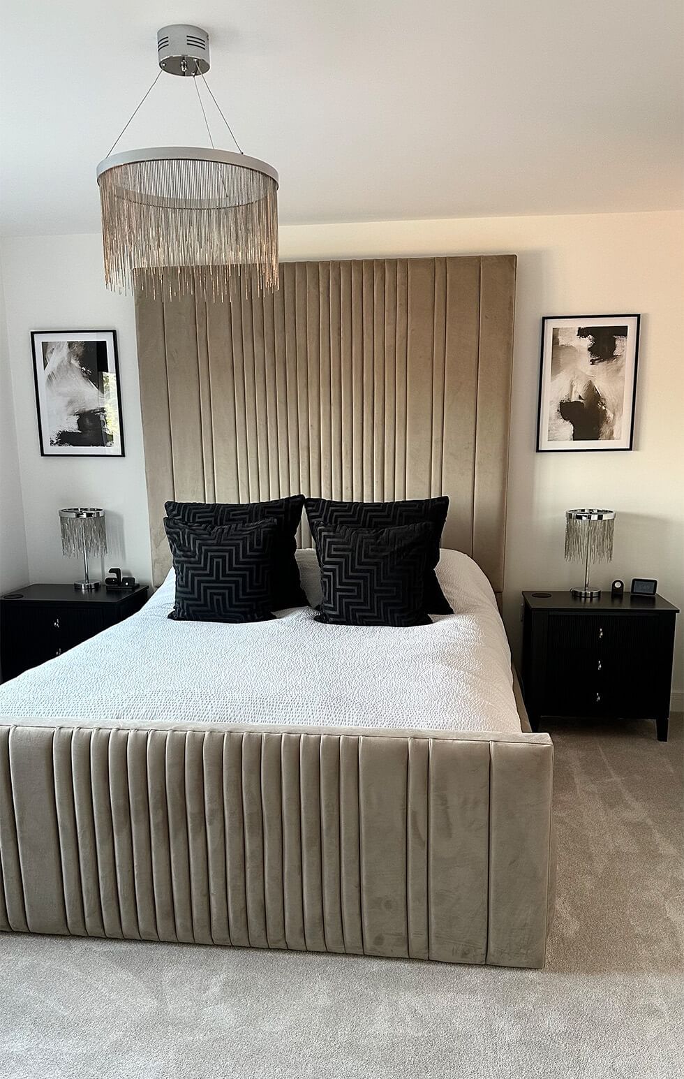 Soft and cosy monochrome bedroom with velvet bed