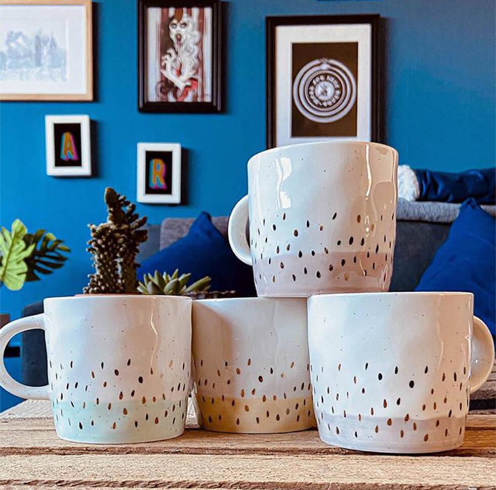 ceramic patterned mugs in a blue living room