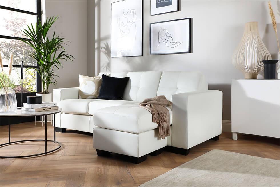 White leather recliner sofa in a modern white living room
