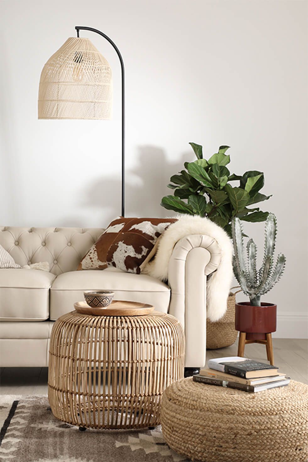 A relaxing living room with an ivory leather Chesterfield sofa and natural accessories