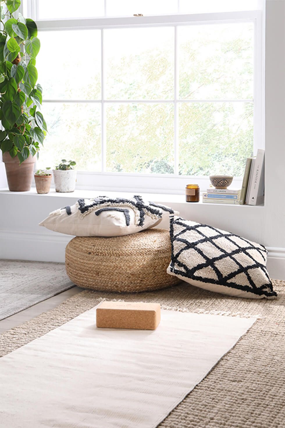 Relaxation nook with cushions and yoga accessories