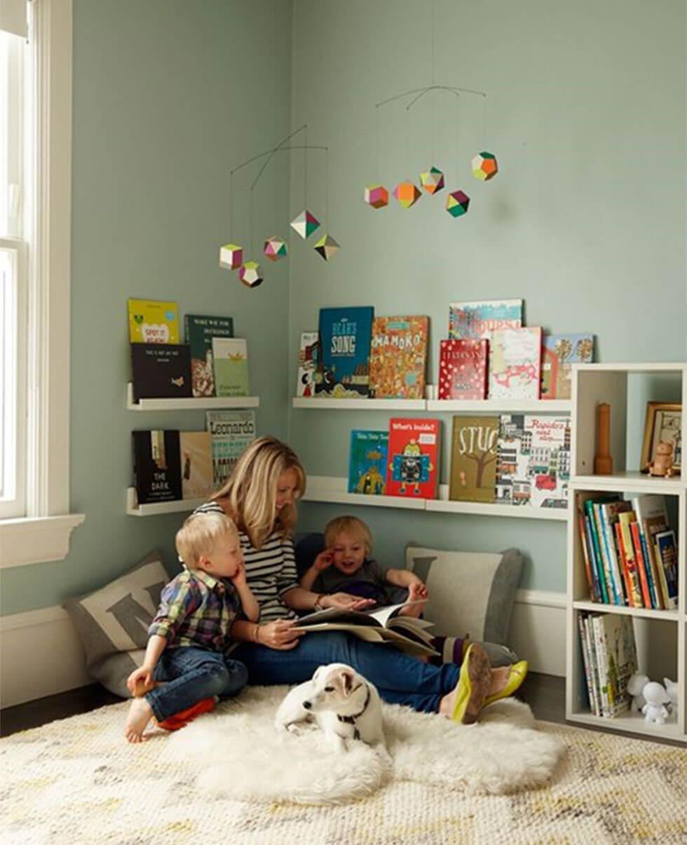 cosy children's reading nook in blue bedroom with a dog