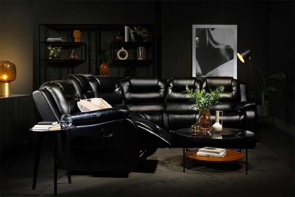Black monochrome living room with a recliner corner sofa